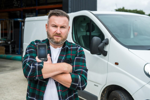 Service technician standing in front of van